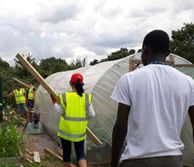 peole building a greenhouse