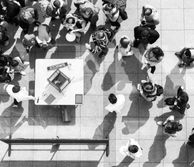 Large group of people chatting in small groups