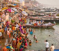 crowds of people on the banks of the ganges