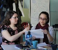 Two researchers looking at a piece of paper