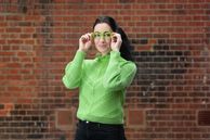 Dr Elena, Lecturer, Dyson School of Design Engineering posing with glasses that depict rising sea levels for new MSc course MSc Cleantech