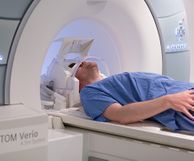 Man lies in MRI scanner