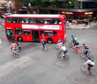 Aerial view of a bus and lots of cyclists