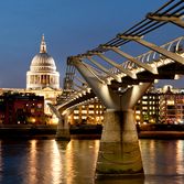 Photo of St. Paul's Cathedral and the Millennium Bridge at night
