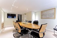 Meeting room showcasing chairs surrounding a table