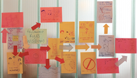 A map of post-it notes with reflections on the programme