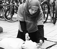 Student administering CPR