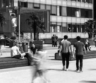 Students sitting and walking around campus