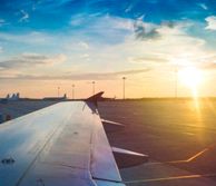 Plane wing and sunset