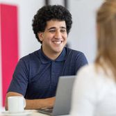 Student smiling being interviewed