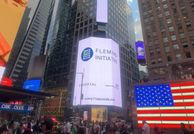A corner of Time Square is illuminated with a Fleming Initiative bill board