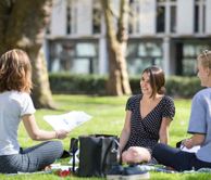 Students relaxing on the grass 