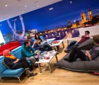 Students sitting on sofas and bean bags