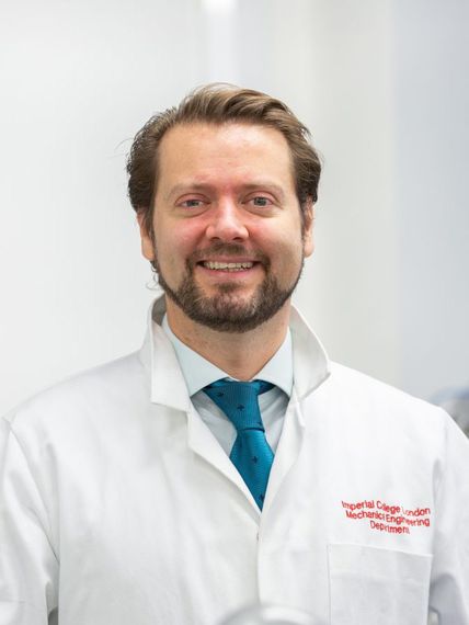 Professor of Medical Robotics, Ferdinando Rodriguez Baena, in lab coat