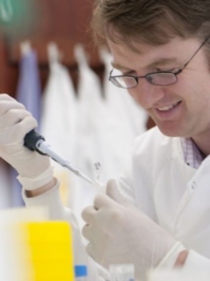 John Tregoning pipetting in the lab