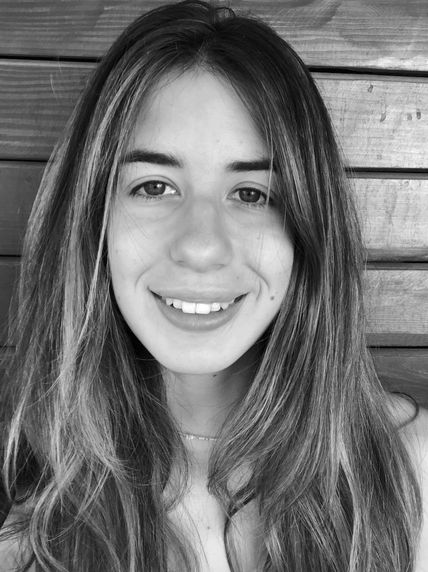 black and white headshot of woman smiling 