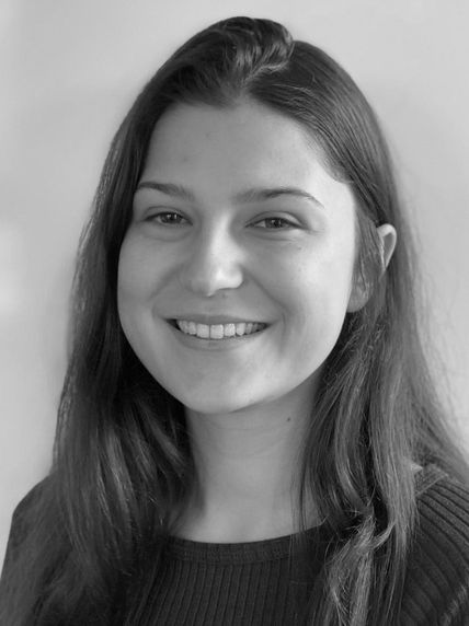 Black and white headshot of woman smiling