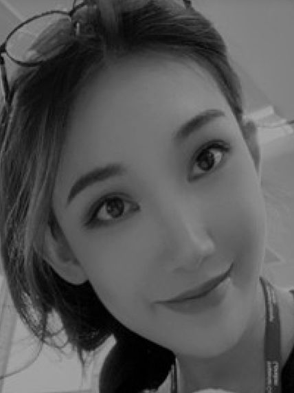 Black and white head shot of woman smiling