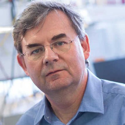 Portrait of Professor Martyn Boutelle in a lab