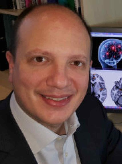 Dr Alexander Comninos