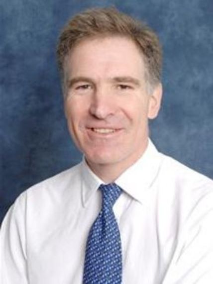 A portrait photograph of Professor Mark Johnson