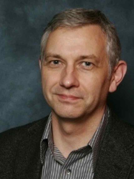 Headshot of Dr Adrian Butler