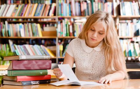 Woman studying with books