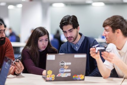 Group of students working on a laptop