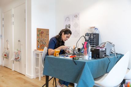 A researcher works on an experiment in her home during the COVID-19 pandemic