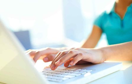 Young woman using keyboard