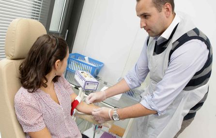 Doctor at health centre with patient