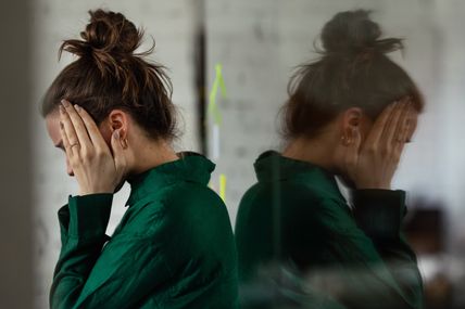 Woman hoding her face