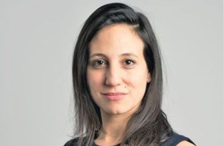 Headshot of Tiffany Howard against a grey background