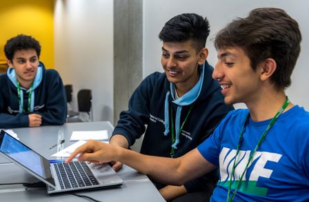 School students attend an Outreach event