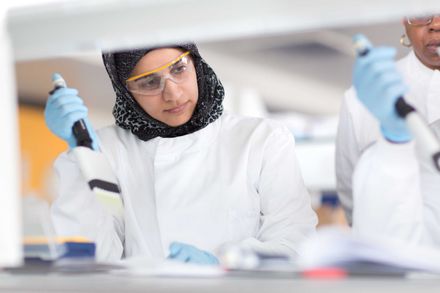 Woman learning laboratory skills