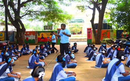Dr Thinesh Thangadurai presents to a group of students at Kalapet girls school, as part of AMR awareness week