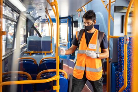 Dr Carl Desouza of the Aerosol Science Team, Environmental Research Group, sampling for COVID-19 on a Transport For London (TFL) bus.