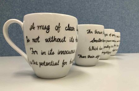 Drinking mugs inscribed with messages 