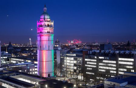 Queens Tower lit up in rainbow colours