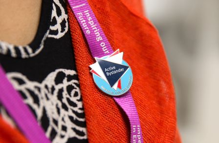 member of staff wearing their Active Bystander pin badge