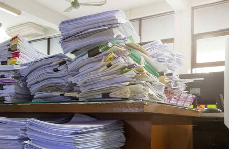 Piles of paper documents
