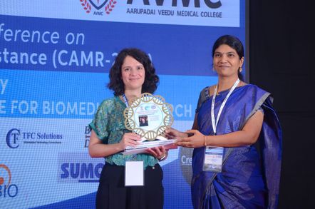 Dr Ana Vieira presented with a commemorative plaque at ARMIC