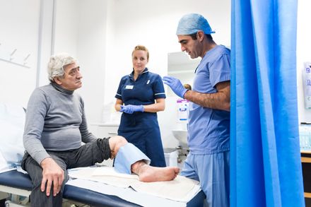 Surgeon and nurse with patient at Charing Cross Hospital