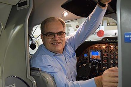 John Maris pictured in a plane cockpit