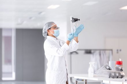 A volunteer at Imperial College London's COVID-19 Response Team making a disposable visor for Imperial College Healthcare NHS Trust hospitals at the Innovation and Translation Hub at the White City Campus