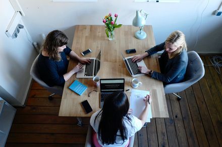 Image of 3 staff working together