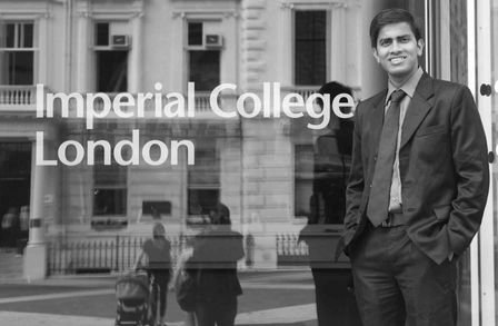 Neeraj standing in front of Imperial College London sign