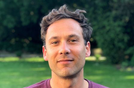 Headshot of Marcus Hill with a park in the background