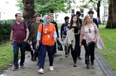 A student leading a campus tour