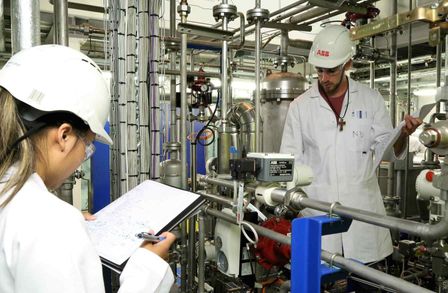 Summer school students inspecting the carbon capture pilot plant 